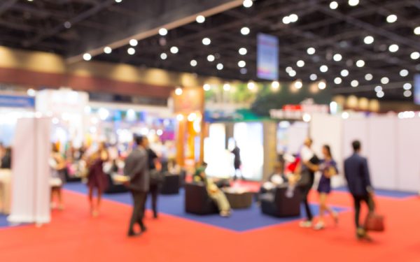 Abstract blurred event exhibition with people background, business convention show concept.